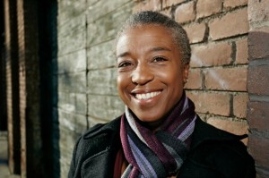 Black woman smiling on city street