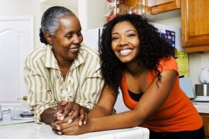 Mother and daughter standing in a kitchen