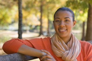 African American woman sitting in park