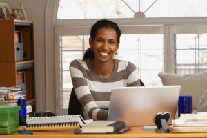 Black woman working in home office
