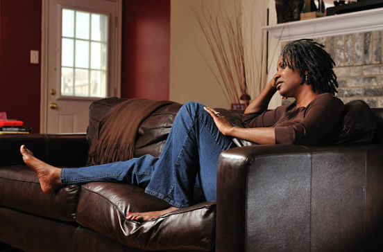 black woman thinking and sitting