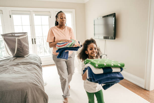 black mom and daughter cleaning 2021