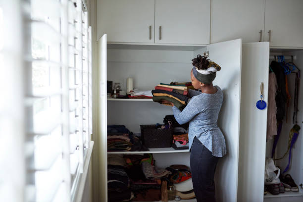 Black Woman Cleaning Room.