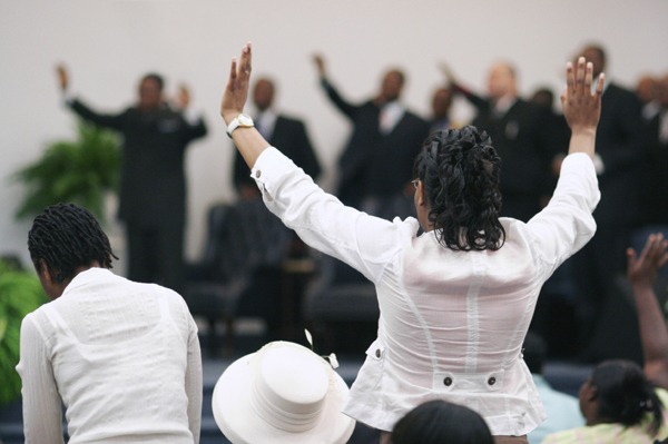 Black Woman Praising The Lord.
